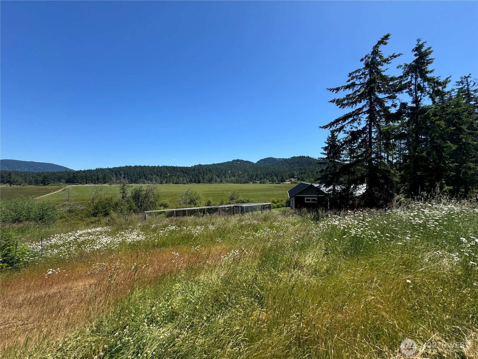 4263 Orcas Road Orcas Island, WA 98245 - Photo 2 of 39 a view of a lake with a yard