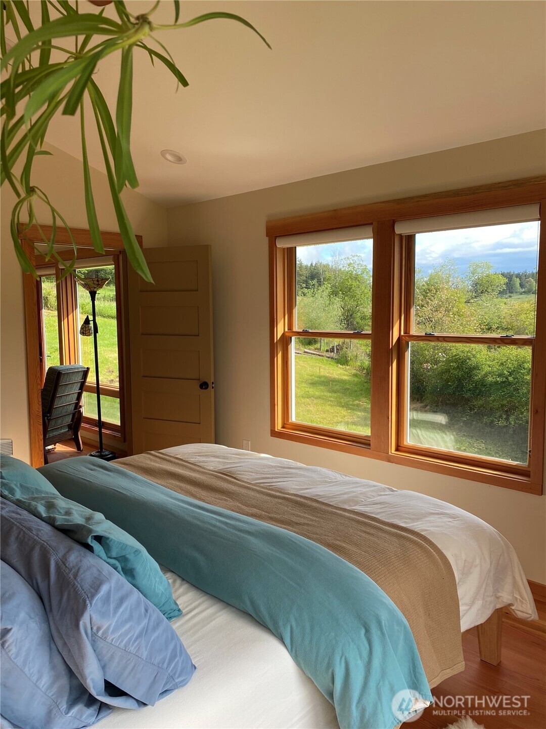 4263 Orcas Road Orcas Island, WA 98245 - Photo 30 of 39 a bedroom with a bed and a large window