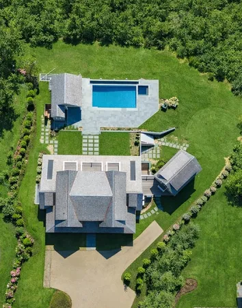 an aerial view of a house with a garden