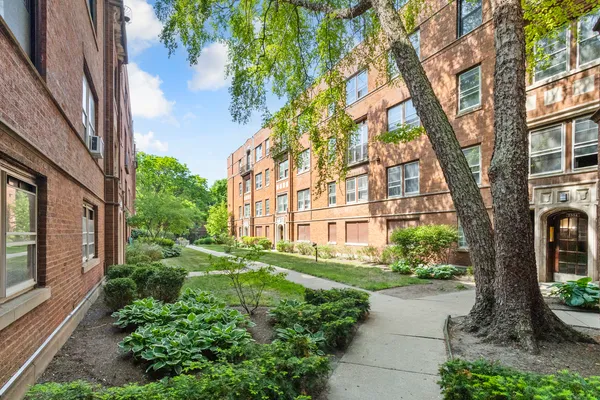 a view of a building with a garden