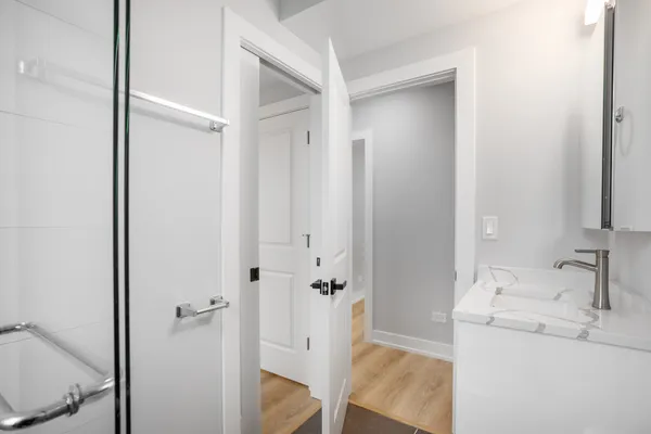 a bathroom with a sink and mirror