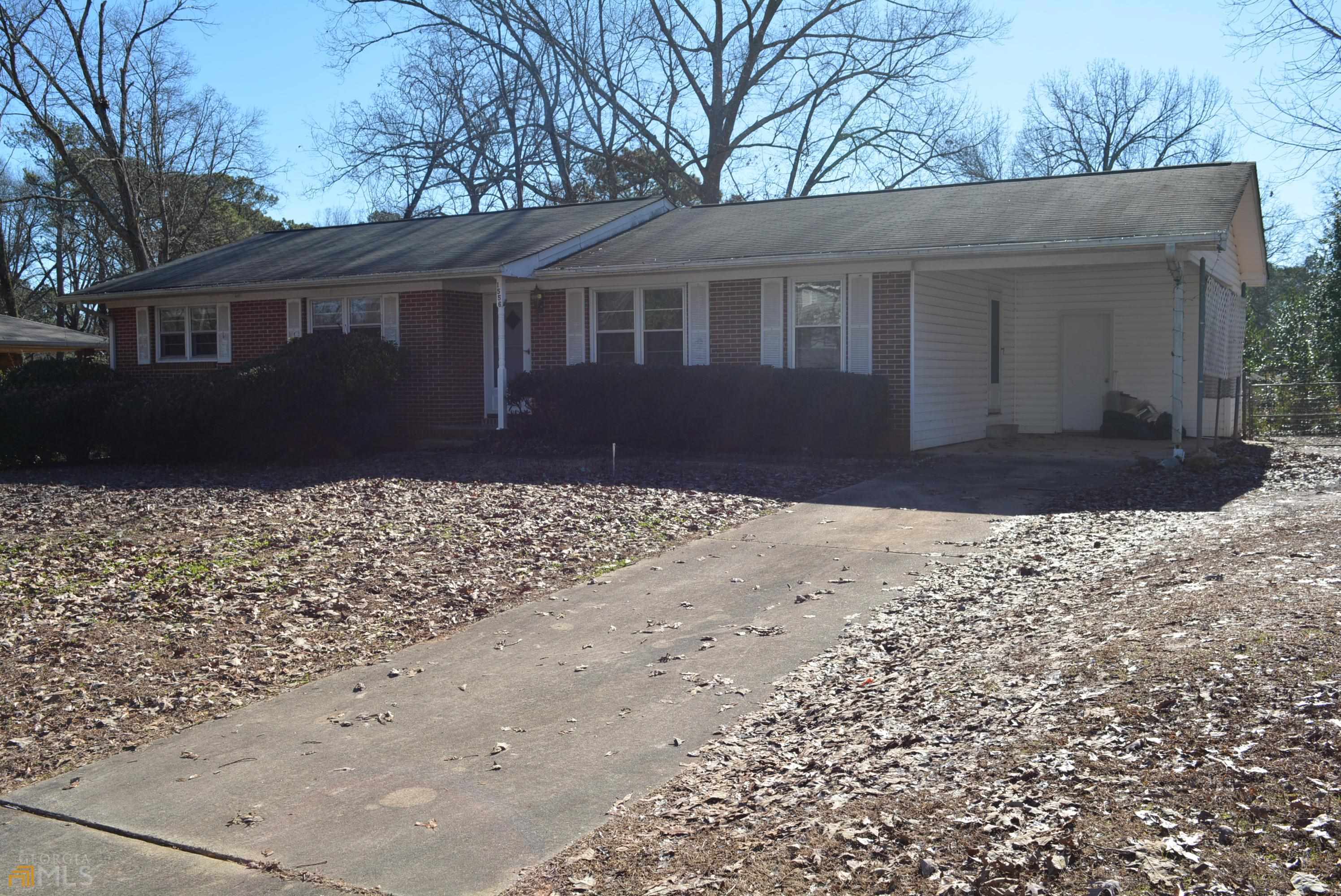 1556 Plover Road Hampton, GA 30228 - Photo 1 of 1 a front view of a house with a yard
