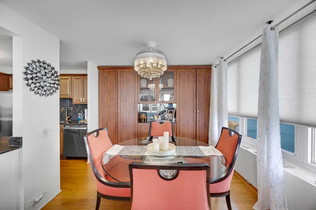 a view of a dining room with furniture window and wooden floor