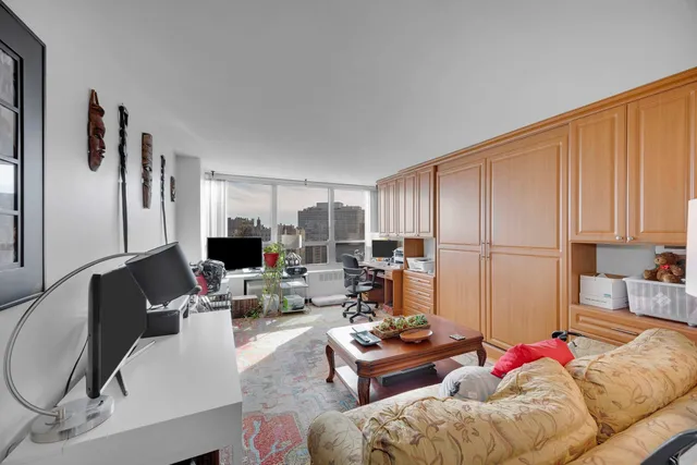 a living room with furniture and a window