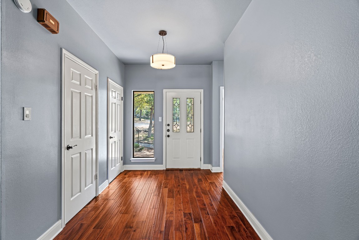 128 Mockingbird Lane Georgetown, TX 78633 - Photo 21 of 40 wooden floor in an empty room with a window
