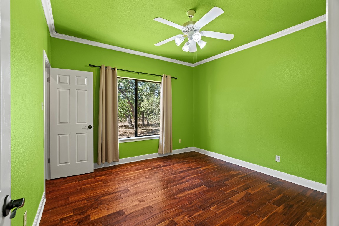 128 Mockingbird Lane Georgetown, TX 78633 - Photo 25 of 40 a view of an empty room with a window and wooden floor