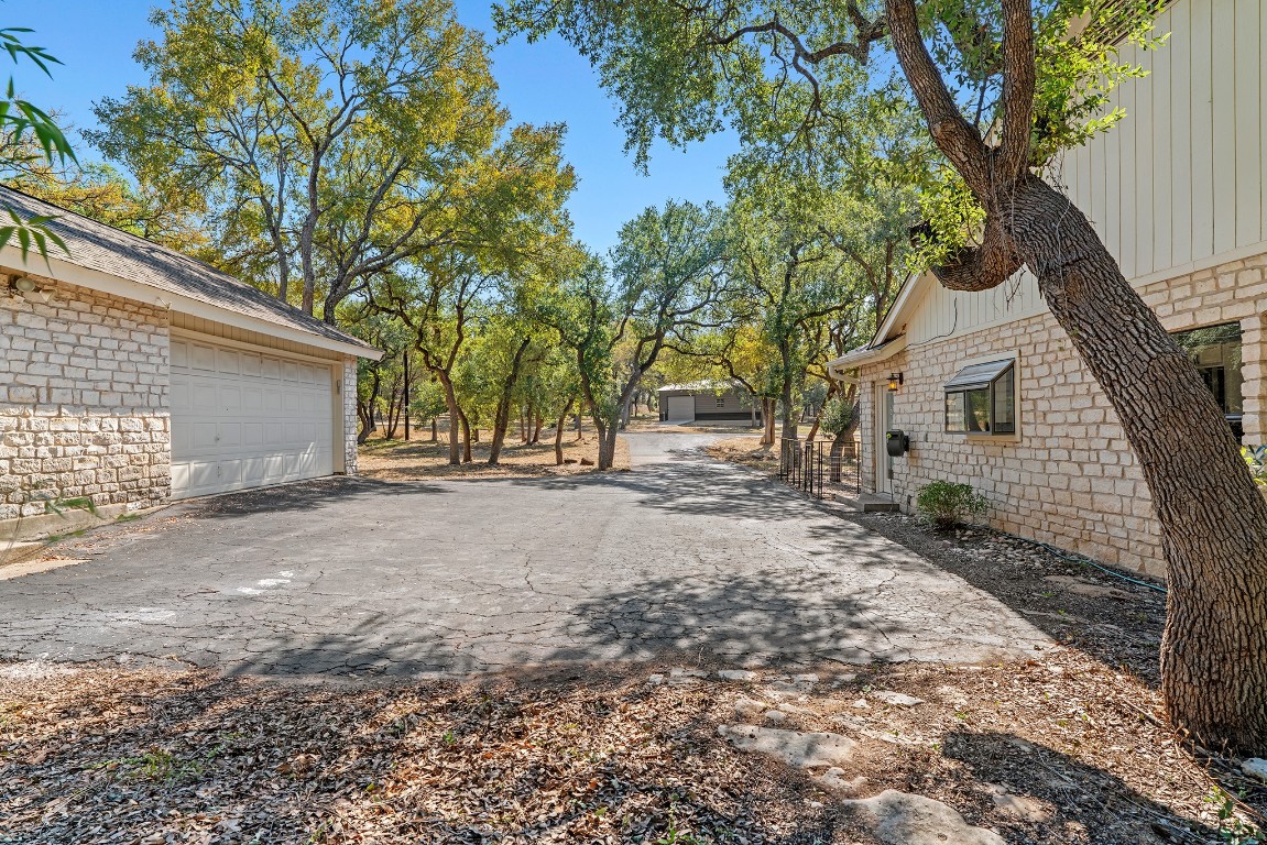 128 Mockingbird Lane Georgetown, TX 78633 - Photo 36 of 40 a view of a backyard with large trees