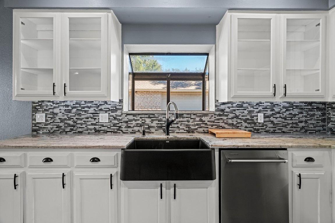 128 Mockingbird Lane Georgetown, TX 78633 - Photo 6 of 40 a kitchen with granite countertop a sink and a window