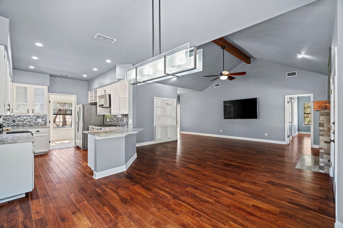 128 Mockingbird Lane Georgetown, TX 78633 - Photo 9 of 40 a view of kitchen and dining room with wooden floor