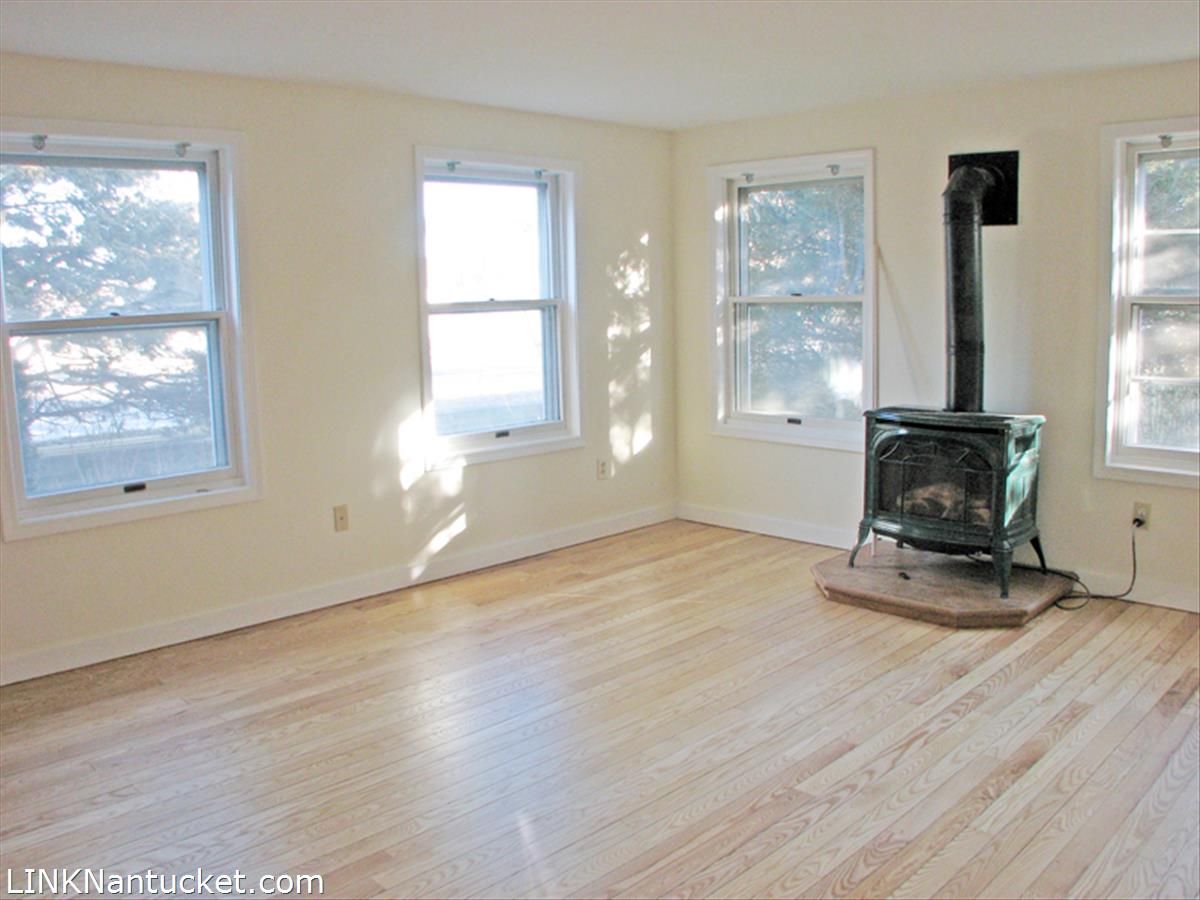31 Surfside Road Nantucket, MA 02554 - Photo 4 of 9 Living room with gas stove
