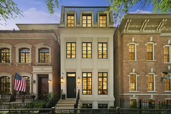 a front view of a residential apartment building with a yard