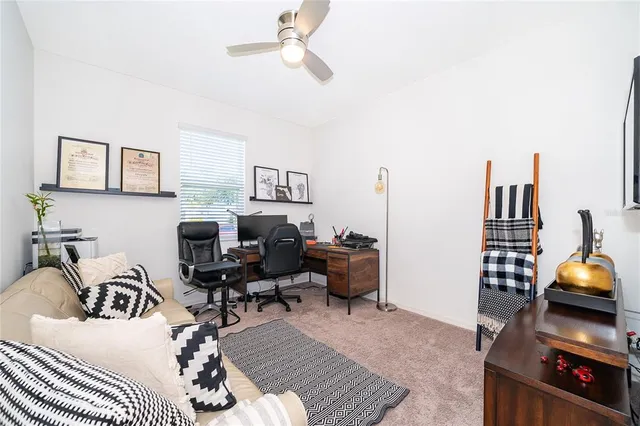 a living room with furniture a rug and a window