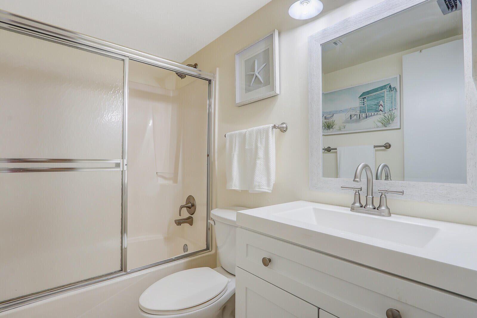 2051 Northeast Ocean Boulevard, Unit A12 Stuart, FL 34996 - Photo 14 of 39 a bathroom with a sink toilet and shower