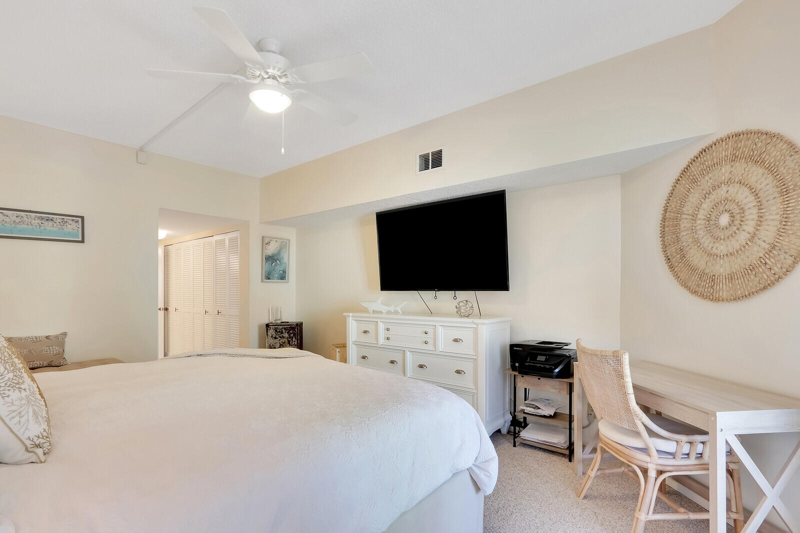 2051 Northeast Ocean Boulevard, Unit A12 Stuart, FL 34996 - Photo 15 of 39 a bedroom with a bed and a flat screen tv
