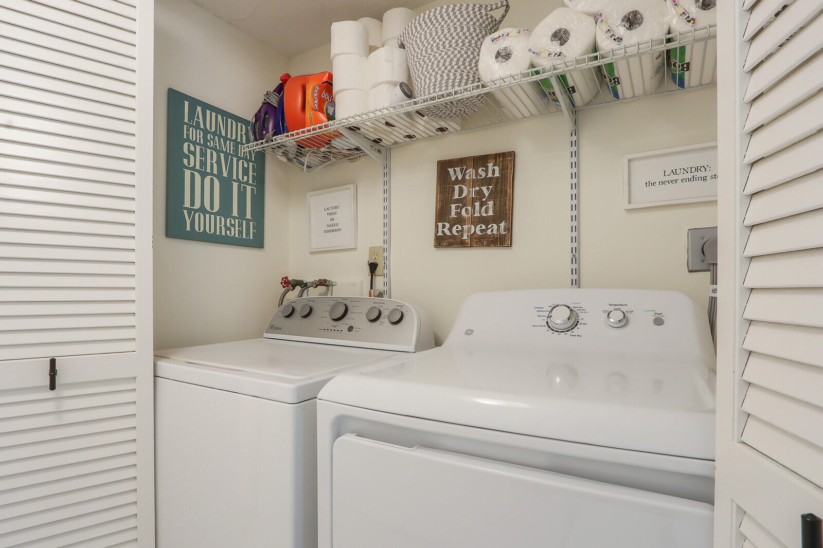 2051 Northeast Ocean Boulevard, Unit A12 Stuart, FL 34996 - Photo 18 of 39 a utility room with dryer and washer