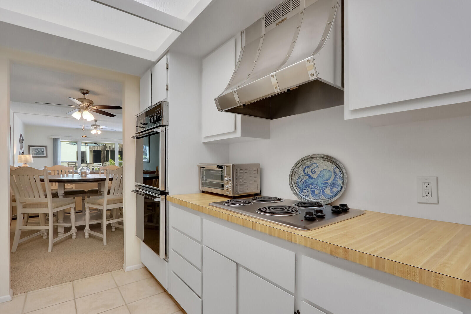2051 Northeast Ocean Boulevard, Unit A12 Stuart, FL 34996 - Photo 9 of 39 a kitchen with a stove and cabinets