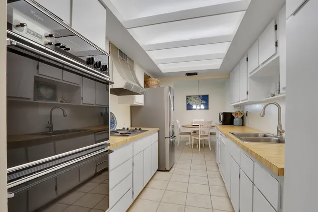 a kitchen with a stove cabinets and counter space