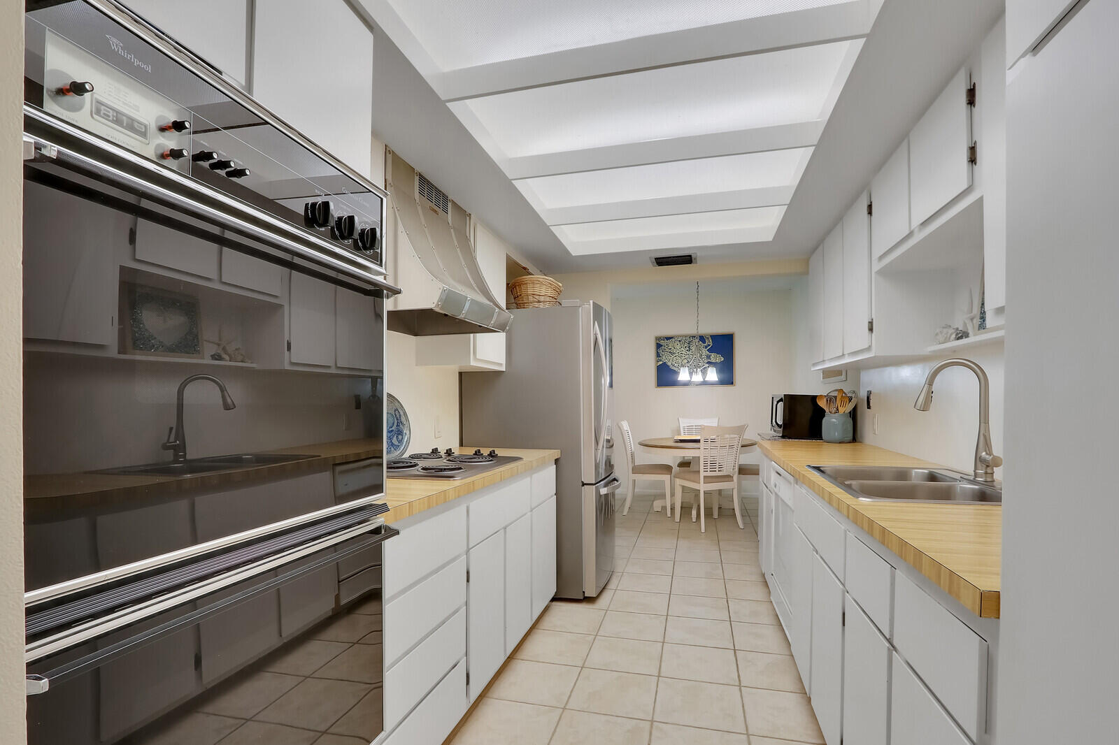 2051 Northeast Ocean Boulevard, Unit A12 Stuart, FL 34996 - Photo 10 of 39 a kitchen with a stove cabinets and counter space