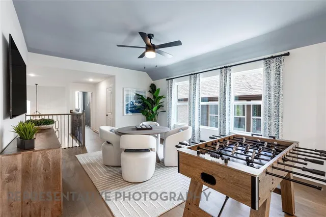 a living room with furniture and a table