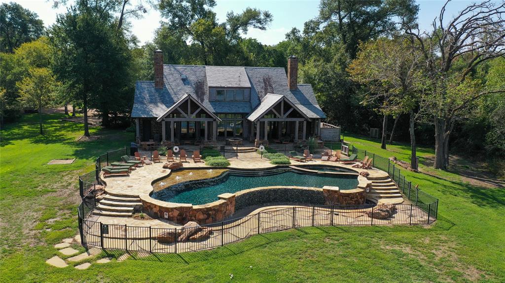 445 Sun Valley Mabank, TX 75147 - Photo 11 of 33 a view of a house with backyard swimming pool and sitting area