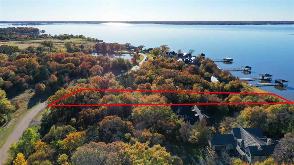 445 Sun Valley Mabank, TX 75147 - Photo 4 of 33 a view of a lake with lots of flowers and around