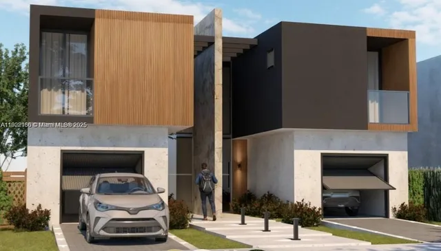 a front view of a house with parking space