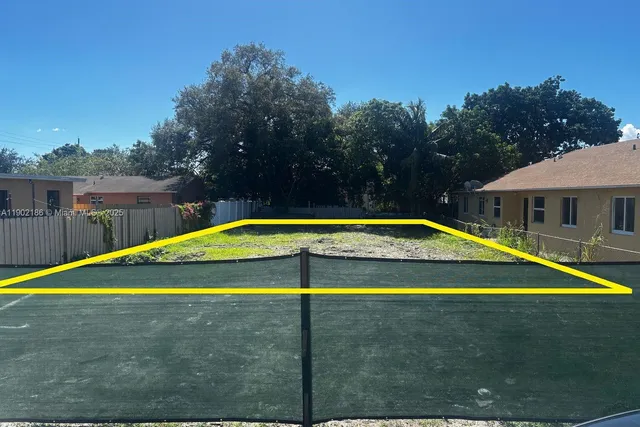 a view of a swimming pool with an outdoor space and seating area