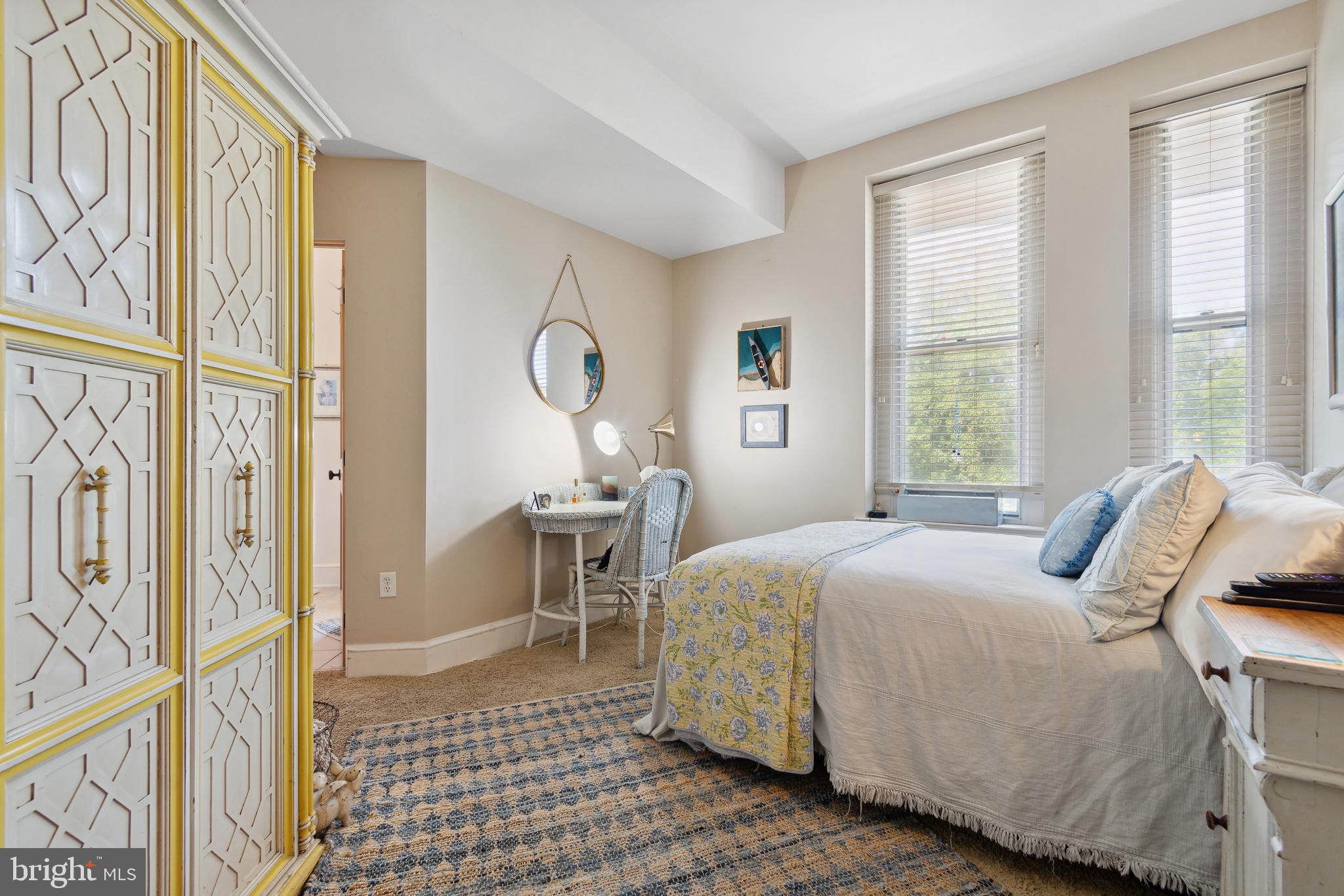 9610 Dewitt Drive, Unit B312 Silver Spring, MD 20910 - Photo 13 of 23 a bedroom with a bed and a window