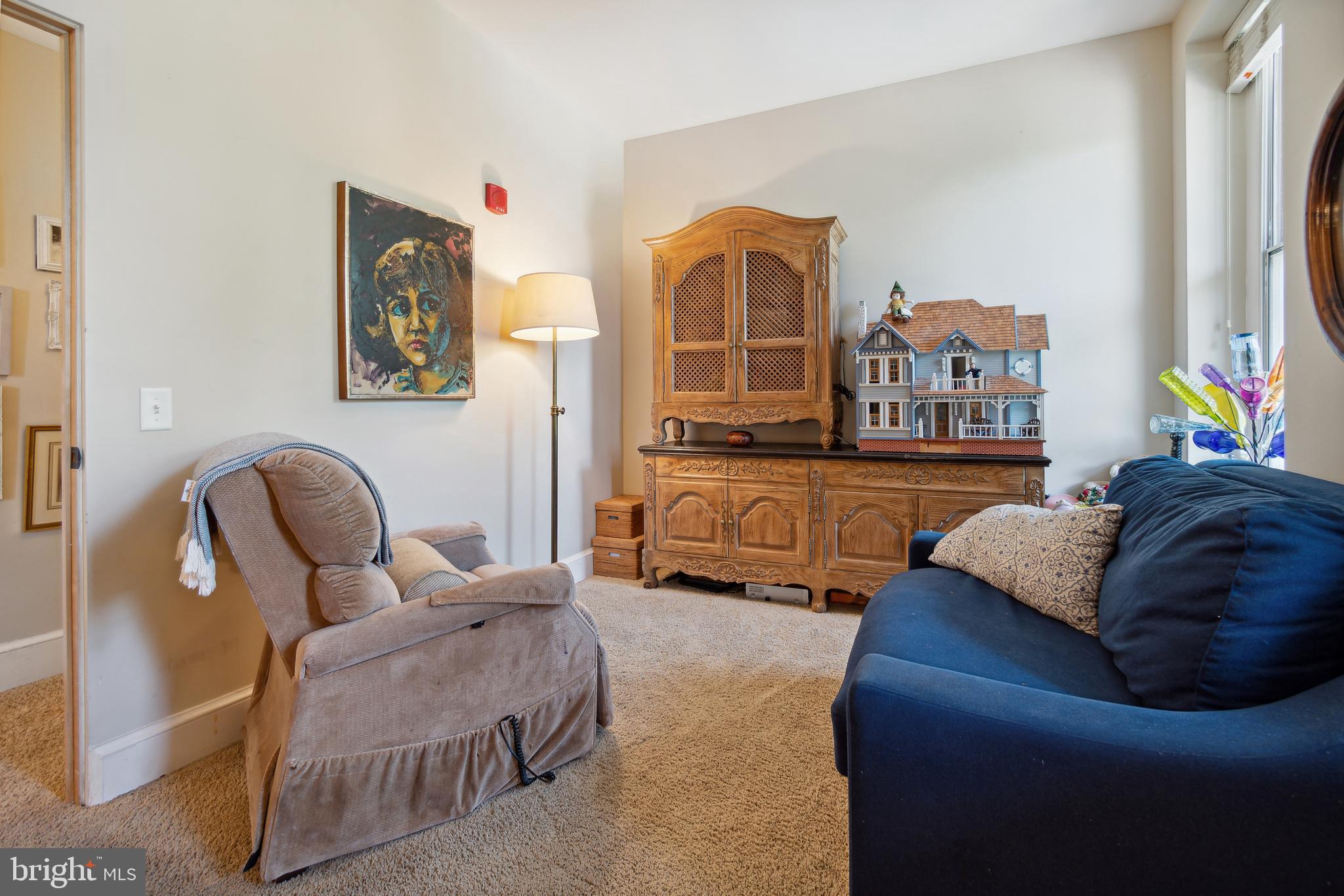 9610 Dewitt Drive, Unit B312 Silver Spring, MD 20910 - Photo 17 of 23 a living room with furniture fireplace and a large window