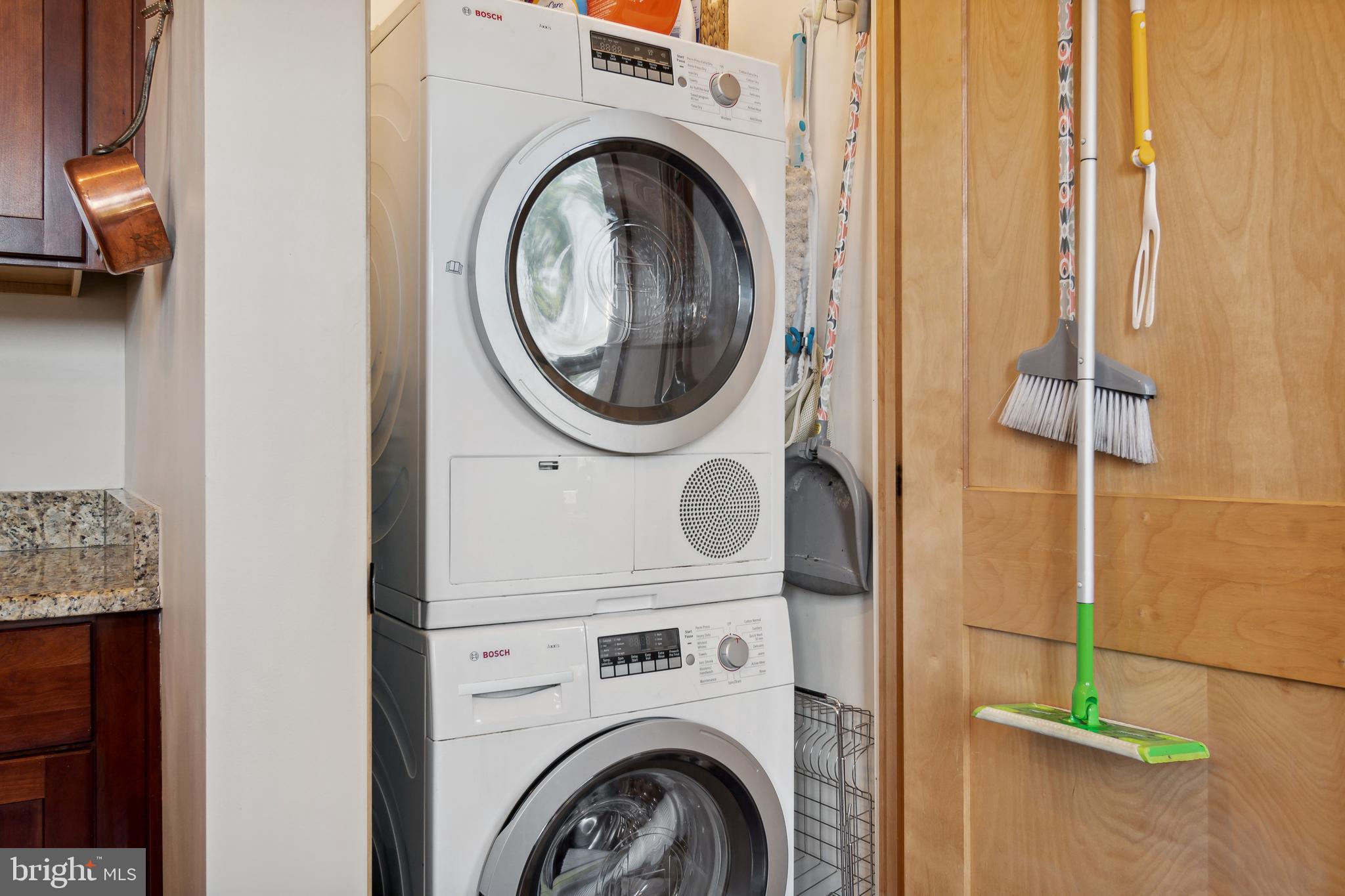 9610 Dewitt Drive, Unit B312 Silver Spring, MD 20910 - Photo 21 of 23 a utility room with dryer and washer