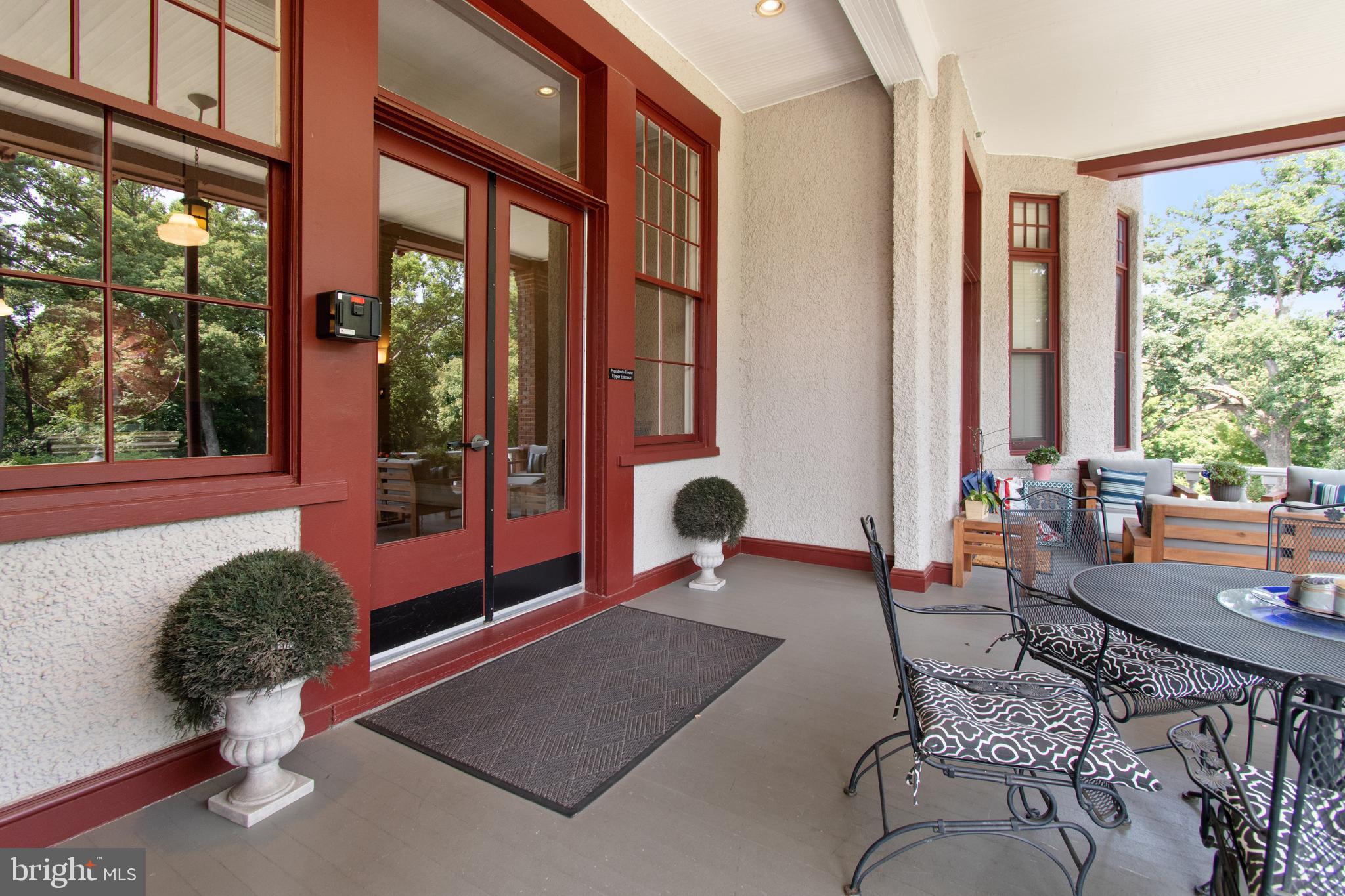 9610 Dewitt Drive, Unit B312 Silver Spring, MD 20910 - Photo 22 of 23 a living room filled with furniture and a potted plant