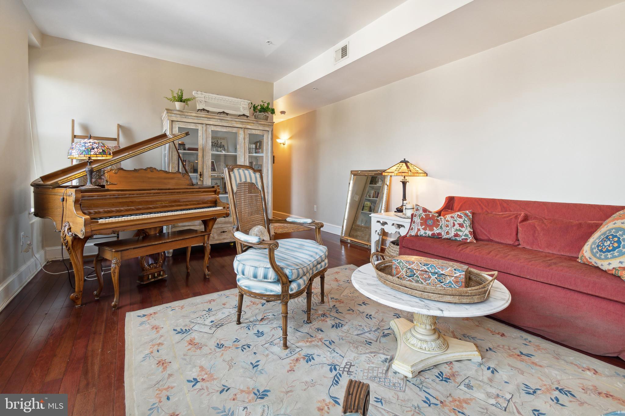 9610 Dewitt Drive, Unit B312 Silver Spring, MD 20910 - Photo 23 of 23 a living room with furniture a piano and wooden floor