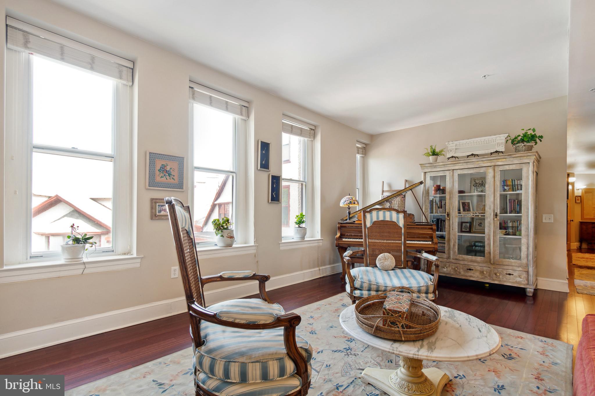 9610 Dewitt Drive, Unit B312 Silver Spring, MD 20910 - Photo 6 of 23 a living room with furniture and a wooden floor