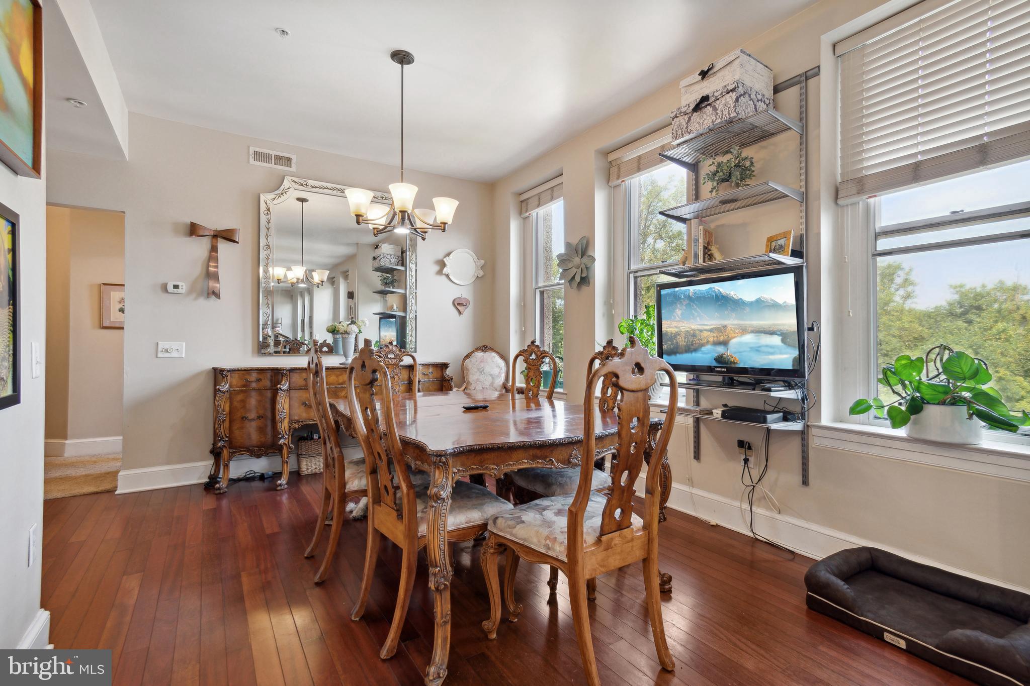 9610 Dewitt Drive, Unit B312 Silver Spring, MD 20910 - Photo 7 of 23 a view of a dining room with furniture window and wooden floor