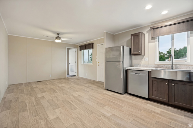 142 Cushing Way Layton, UT 84041 - Photo 1 of 15 Open-concept living space featuring wood-finish flooring, a ceiling fan, and recessed lighting