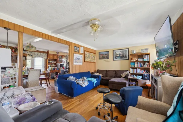 a living room with furniture fireplace and a flat screen tv