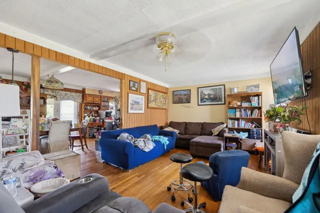 a living room with furniture fireplace and a flat screen tv