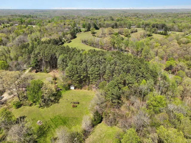a view of a lake with green space