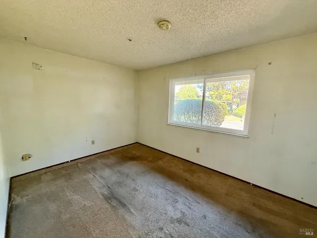 a view of empty room with windows