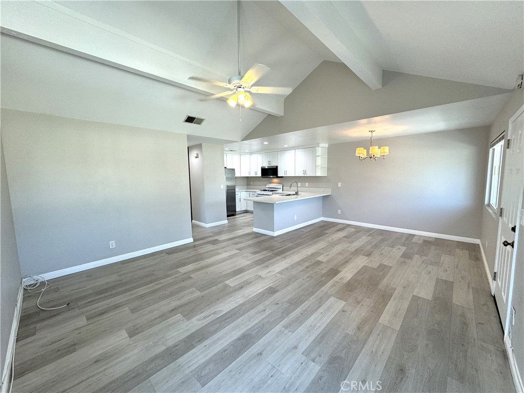 700 West Walnut Avenue, Unit 8 Orange, CA 92868 - Photo 3 of 11 wooden floor in an empty room with a window