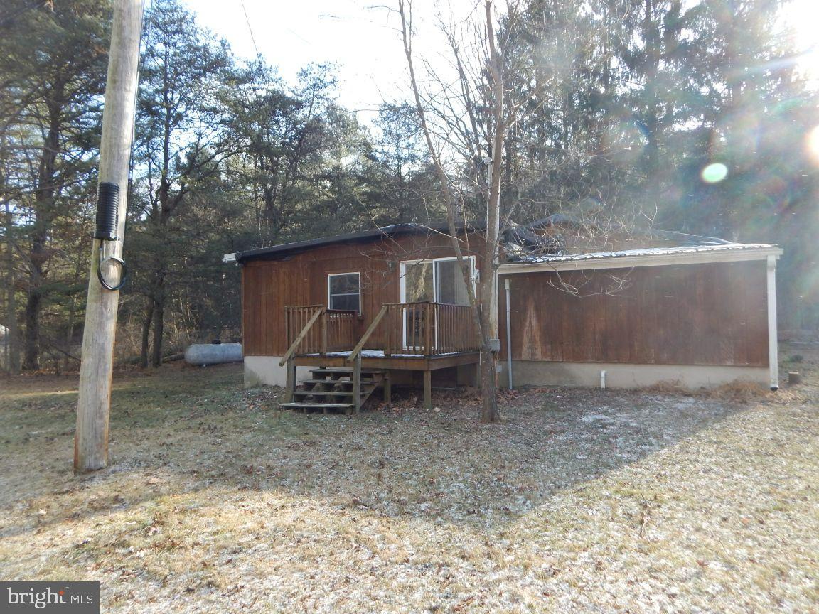 3368 Brushy Fork Road Sugar Grove, WV 26815 - Photo 15 of 15 a view of a house with a yard and large tree