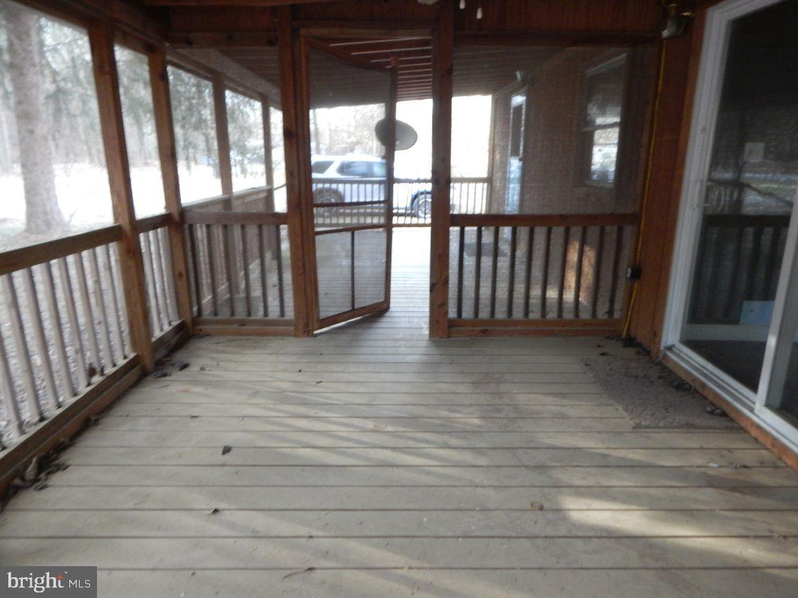 3368 Brushy Fork Road Sugar Grove, WV 26815 - Photo 3 of 15 a view of staircase with railing and flat screen tv