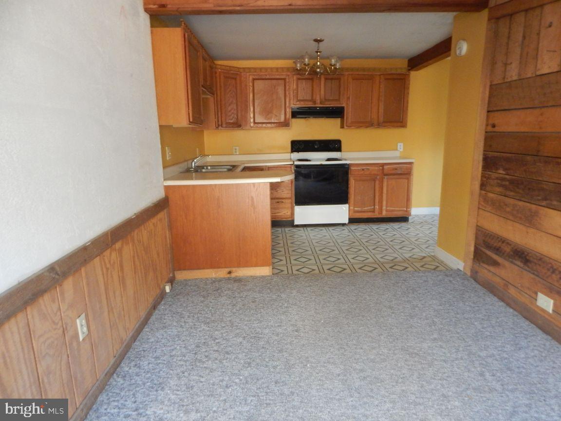 3368 Brushy Fork Road Sugar Grove, WV 26815 - Photo 9 of 15 a kitchen with stainless steel appliances granite countertop a stove a sink and a refrigerator