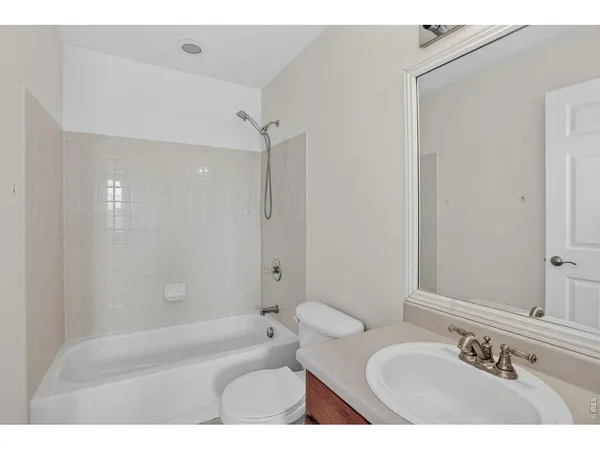 an empty room with a window and closet