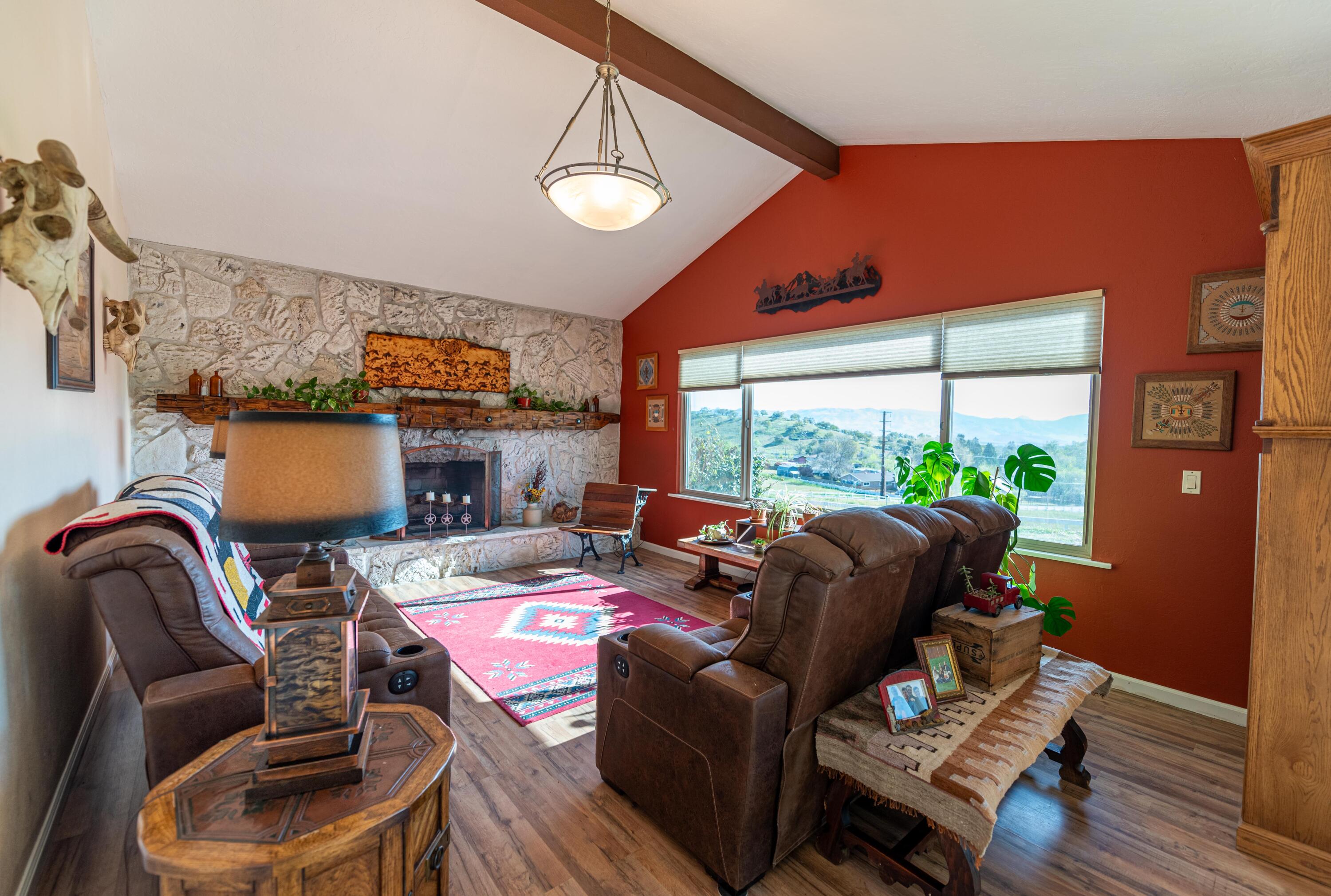 21970 Highline Road Tehachapi, CA 93561 - Photo 24 of 68 a living room with furniture fireplace and a large window