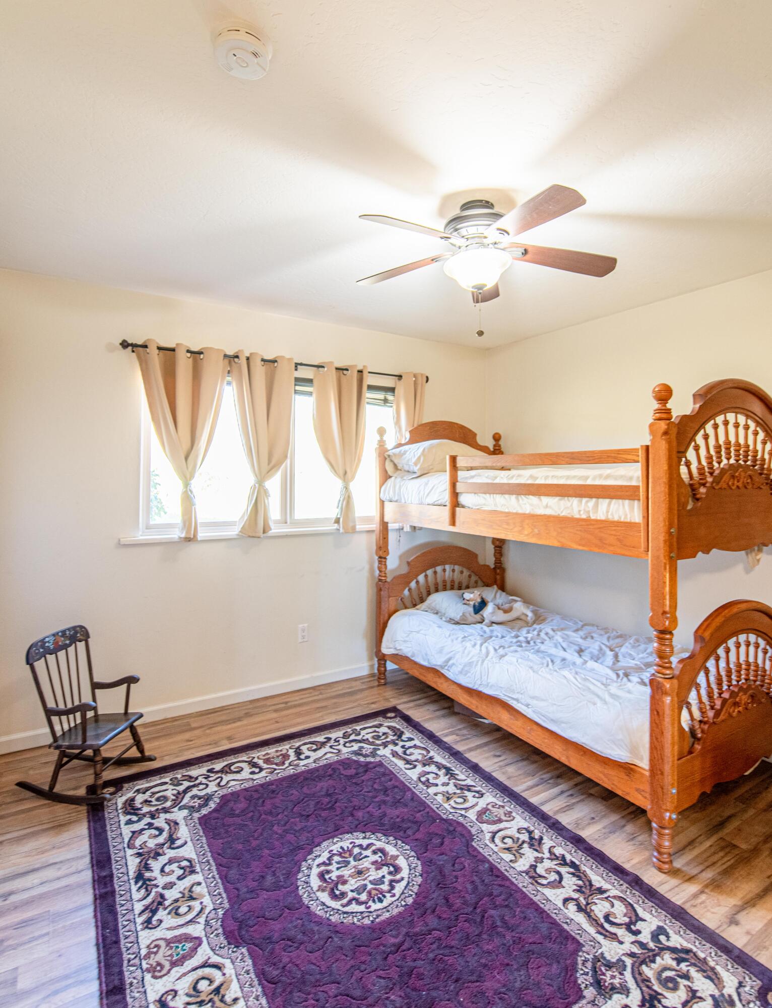 21970 Highline Road Tehachapi, CA 93561 - Photo 41 of 68 a view of a bedroom with furniture and window