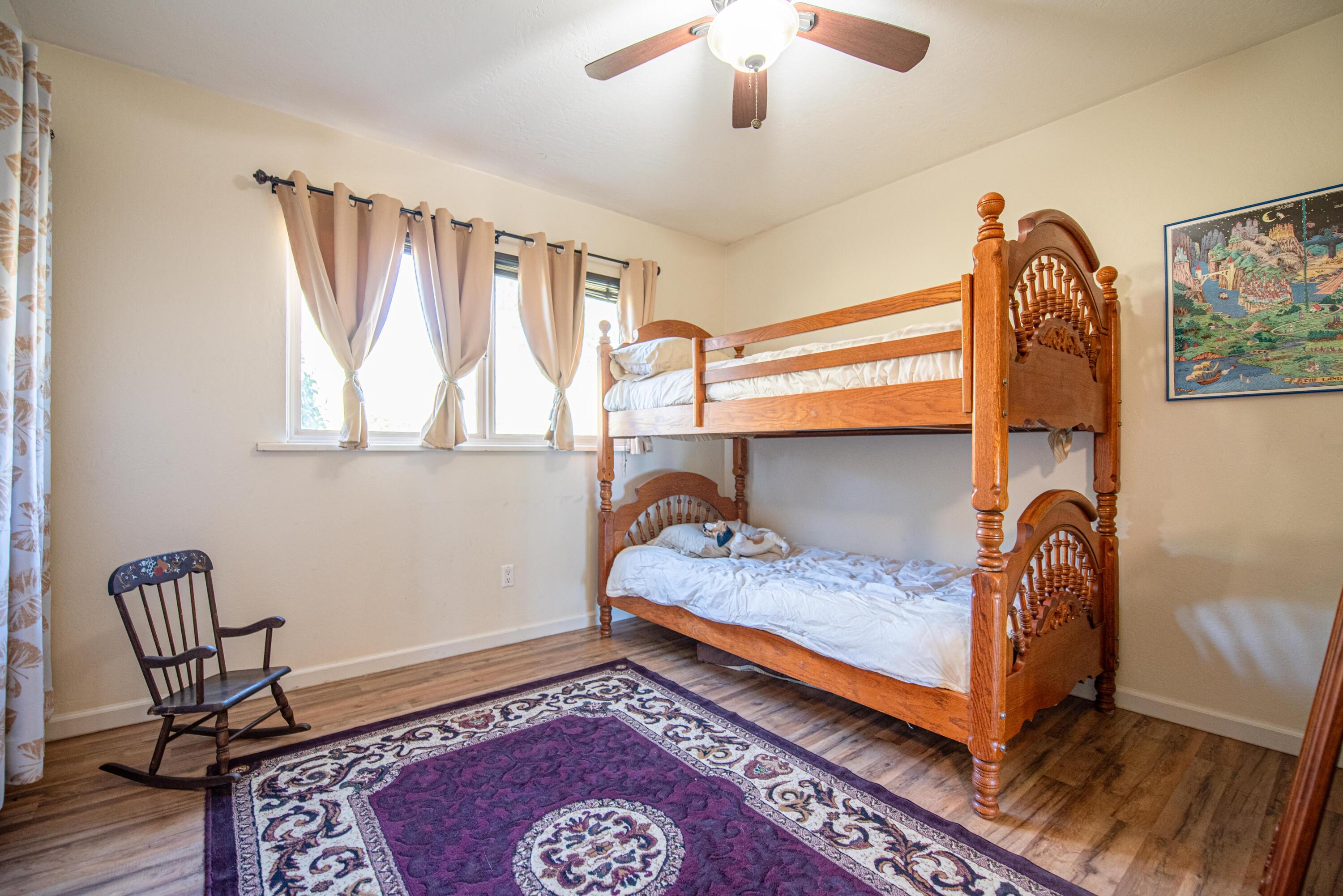 21970 Highline Road Tehachapi, CA 93561 - Photo 42 of 68 a bedroom with a bed and a window