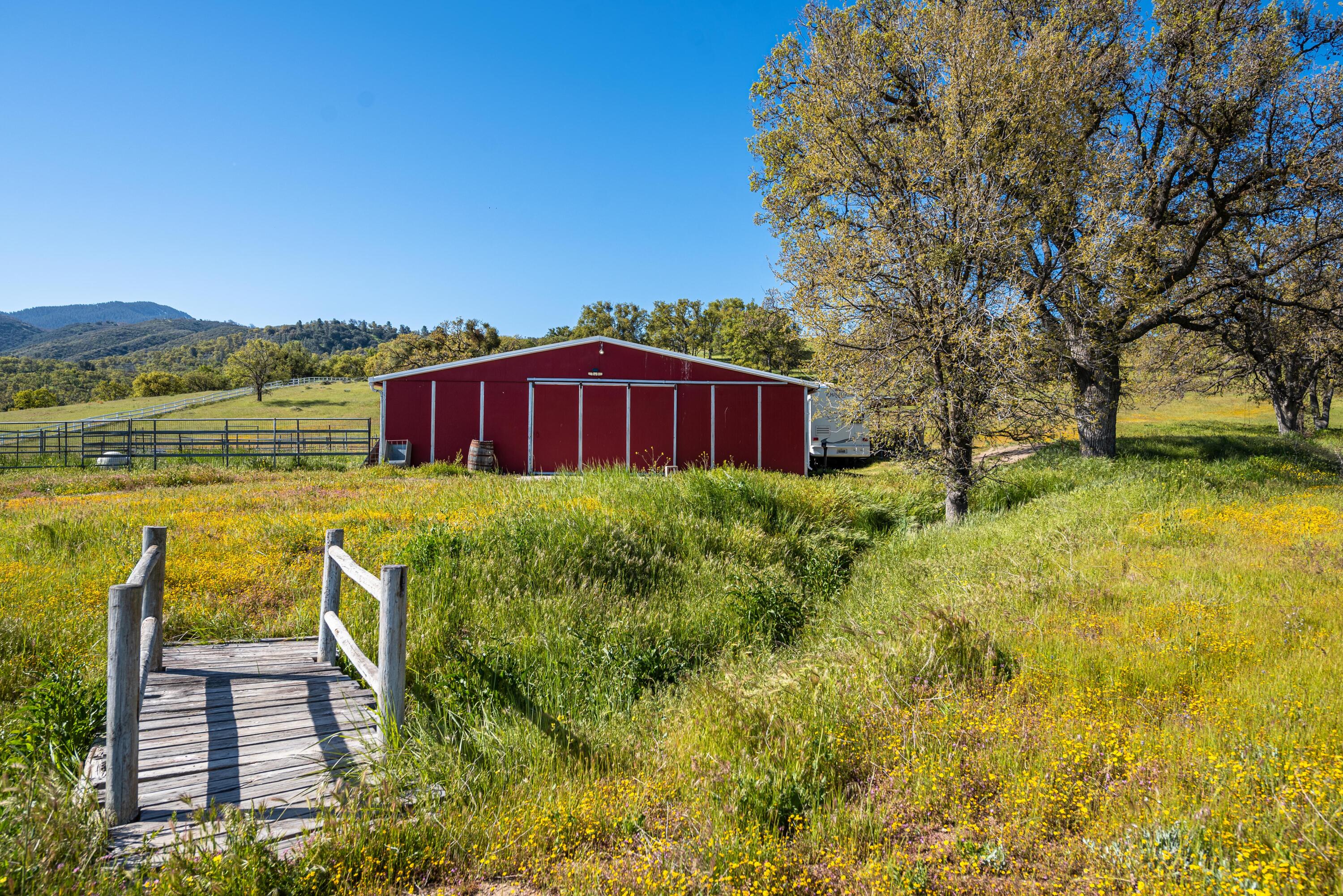 21970 Highline Road Tehachapi, CA 93561 - Photo 54 of 68 a view of a house with a yard and sitting area