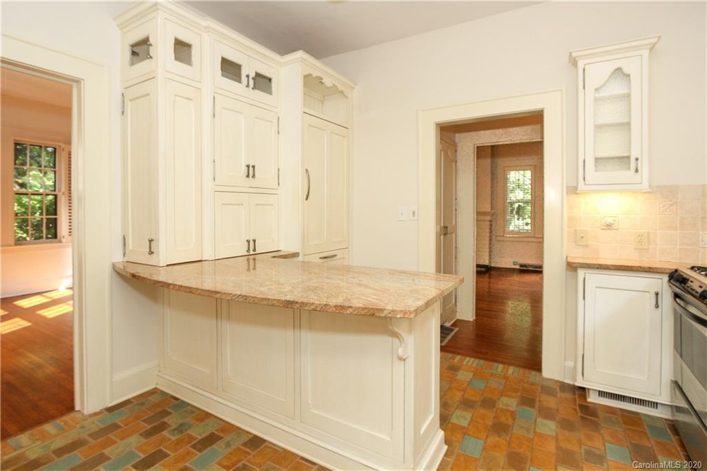 2120 Malvern Road Charlotte, NC 28207 - Photo 11 of 46 a bathroom with a granite countertop sink and a mirror