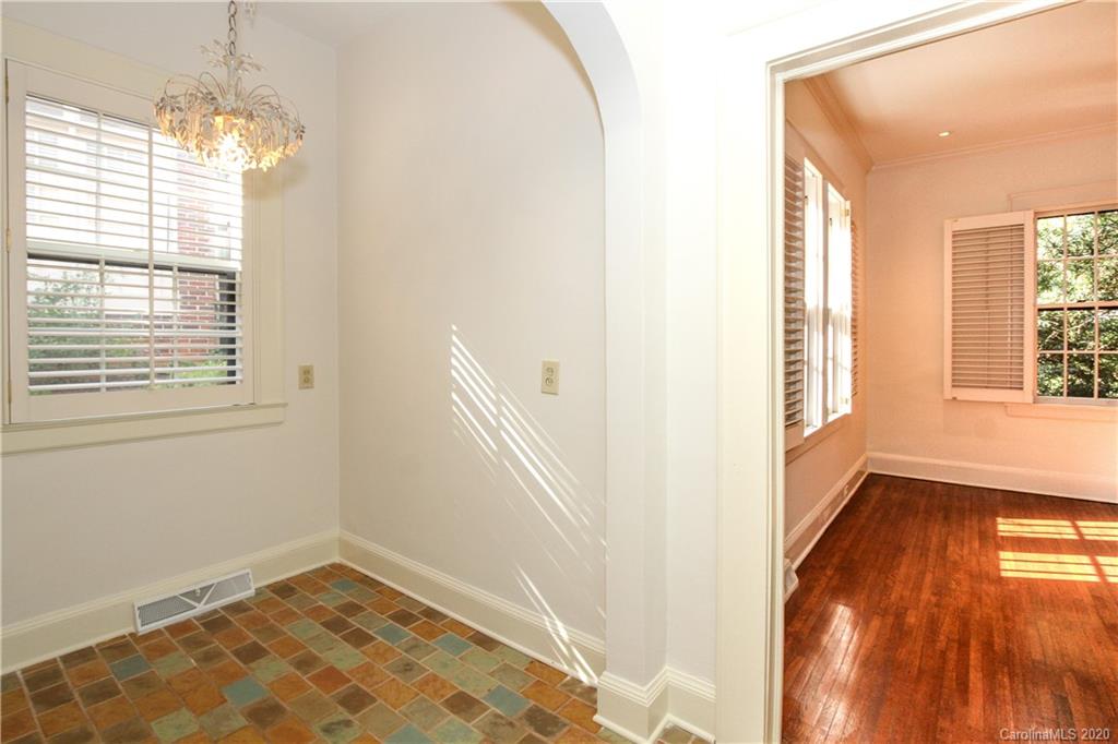 2120 Malvern Road Charlotte, NC 28207 - Photo 13 of 46 a view of an empty room with wooden floor and a window